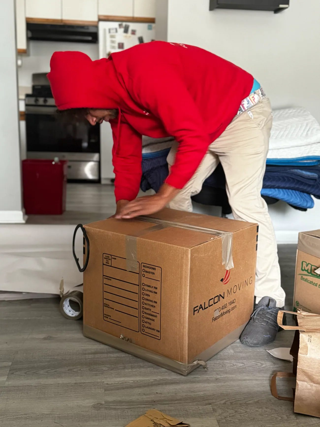 Falcon Moving crew member preparing household items with care